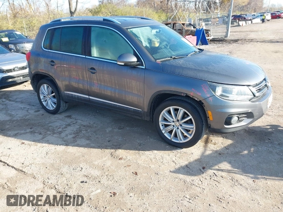 2012 Volkswagen Tiguan SEL with VIN WVGAV7AX2CW000962, listed as a IAAI auction lot 40815475 with 162,859 mi miles and . Bid and sale history available at DreamBid. Image 1.