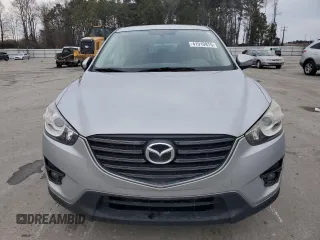 2016 Mazda CX-5 Touring with VIN JM3KE2CY1G0884474, listed as a Copart auction lot 41910975 with 106,120 mi miles and Salvage Title. Bid and sale history available at carsss.com. Image 5.