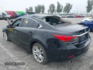 2014 Mazda 6 i Touring with VIN JM1GJ1T6XE1162480, listed as a IAAI auction lot 42150777 with 148,113 mi miles and . Bid and sale history available at DreamBid. Image 3.
