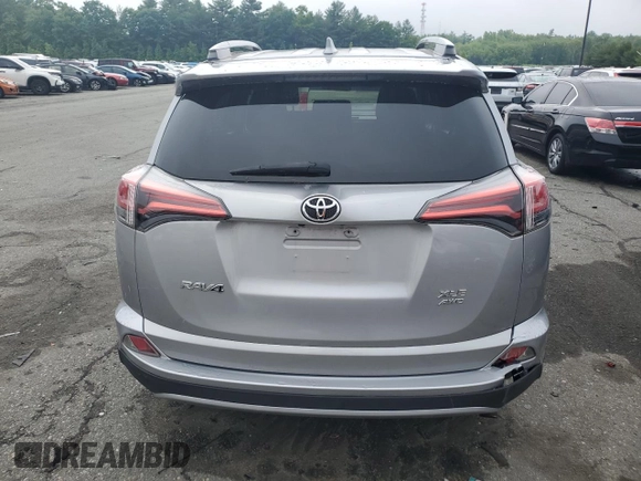 2018 Toyota RAV4 XLE with VIN 2T3RFREV8JW741461, listed as a Copart auction lot 57728244 with 88,925 mi miles and Salvage Title. Bid and sale history available at DreamBid. Image 6.