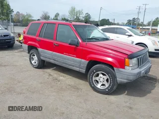 1996 Jeep Grand Cherokee Laredo z VIN 1J4FX58S4TC346218, wystawiony jako IAAI lot #41943268 z przebiegiem 138 431 mil mil oraz . Historia ofert i sprzedaży dostępna na DreamBid. Obrazek 1.