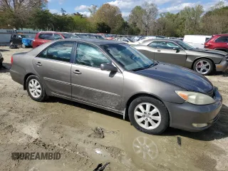 2003 Toyota Camry LE with VIN 4T1BE30K43U724778, listed as a Copart auction lot 53515605 with 176,568 mi miles and Salvage Title. Bid and sale history available at DreamBid. Image 4.