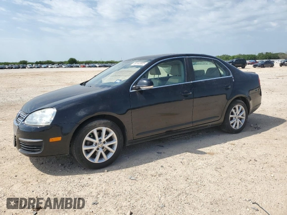 2010 Volkswagen Jetta SE with VIN 3VWRX7AJXAM049320, listed as a Copart auction lot 56142005 with 127,002 mi miles and Salvage title. Bid and sale history available at DreamBid. Image 1.