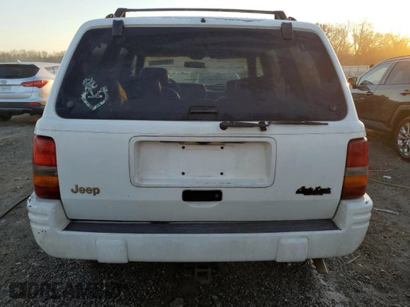 1996 Jeep Grand Cherokee z VIN 1J4FX78S6TC221815, wystawiony jako Copart lot #44000615 z przebiegiem 287 308 mil mil oraz Szkoda całkowita • Salvage title. Historia ofert i sprzedaży dostępna na DreamBid. Obrazek 6.