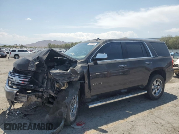 2015 Chevrolet Tahoe LTZ with VIN 1GNSKCKC2FR157035, listed as a Copart auction lot 59990415 with Not provided miles and Salvage title. Bid and sale history available at DreamBid. Image 1.