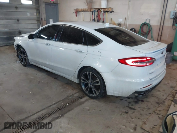 2019 Ford Fusion Titanium with VIN 3FA6P0D92KR153096, listed as a IAAI auction lot 41679393 with 127,292 mi miles and . Bid and sale history available at DreamBid. Image 3.