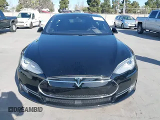 2014 Tesla Model S P85D with VIN 5YJSA1H22EFP65530, listed as a IAAI auction lot 41959941 with 76,532 mi miles and . Bid and sale history available at DreamBid. Image 12.
