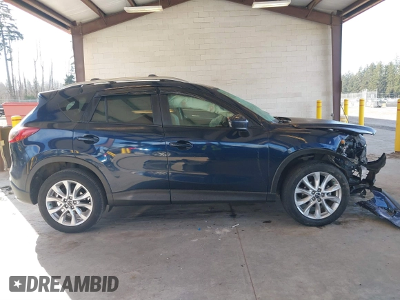 2014 Mazda CX-5 Grand Touring with VIN JM3KE2DY6E0394172, listed as a IAAI auction lot 41698468 with 89,554 mi miles. Bid and sale history available at carsss.com. Image 13.
