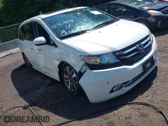 2014 Honda Odyssey Touring with VIN 5FNRL5H94EB071788, listed as a IAAI auction lot 42523959 with 244,734 mi miles and . Bid and sale history available at DreamBid. Image 1.