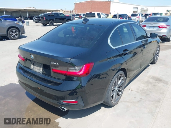 2019 BMW 3 Series 330i with VIN WBA5R1C51KFH09402, listed as a IAAI auction lot 41869138 with 59,115 mi miles and . Bid and sale history available at DreamBid. Image 4.