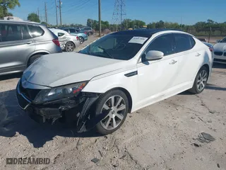 2012 Kia Optima SX with VIN 5XXGR4A6XCG017695, listed as a IAAI auction lot 41837506 with 210,845 mi miles. Bid and sale history available at carsss.com. Image 16.