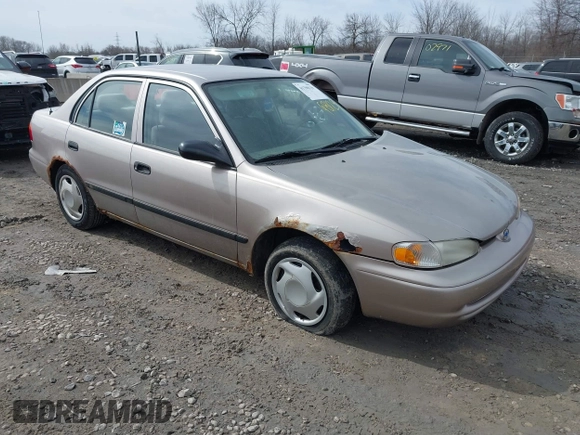 1999 Chevrolet Prizm z VIN 1Y1SK5488XZ446950, wystawiony jako IAAI lot #41798129 z przebiegiem 292 798 mil mil oraz . Historia ofert i sprzedaży dostępna na DreamBid. Obrazek 1.