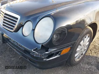 2000 Mercedes-Benz E-Class with VIN WDBJF65J1YB058351, listed as a IAAI auction lot 41834603 with 100,525 mi miles. Bid and sale history available at carsss.com. Image 6.