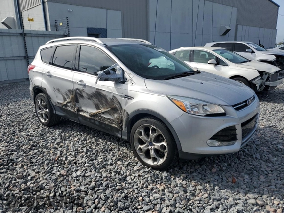 2015 Ford Escape Titanium z VIN 1FMCU0J97FUA14845, wystawiony jako Copart lot #58911445 z przebiegiem 110 437 mil mil oraz Szkoda całkowita • Salvage title. Historia ofert i sprzedaży dostępna na DreamBid. Obrazek 4.