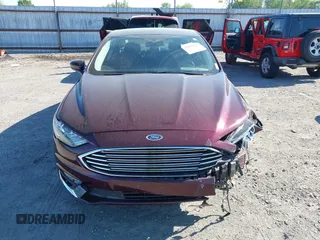 2017 Ford Fusion SE z VIN 3FA6P0H70HR198507, wystawiony jako IAAI lot #42033338 z przebiegiem 94 363 mil mil oraz . Historia ofert i sprzedaży dostępna na DreamBid. Obrazek 12.