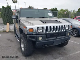2005 Hummer H2 SUV with VIN 5GRGN23U95H129470, listed as a IAAI auction lot 42046654 with 63,489 mi miles. Bid and sale history available at carsss.com. Image 1.
