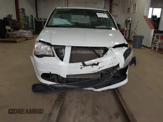 2014 Dodge Grand Caravan American Value with VIN 2C4RDGBG7ER345277, listed as a IAAI auction lot 42061355 with 145,889 mi miles and . Bid and sale history available at DreamBid. Image 6.