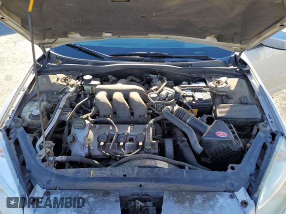 2006 Mercury Milan with VIN 3MEFM07176R612667, listed as a Copart auction lot 77498664 with 145,760 mi miles and Salvage title. Bid and sale history available at DreamBid. Image 12.