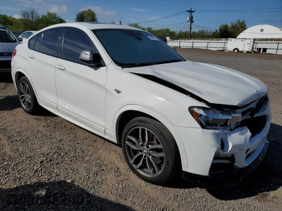 2018 BMW X4 M40i with VIN 5UXXW7C52J0W64443, listed as a Copart auction lot 53877525 with 49,634 mi miles and Salvage title. Bid and sale history available at DreamBid. Image 4.