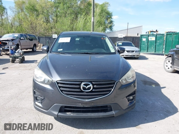 2016 Mazda CX-5 Touring z VIN JM3KE2CY4G0708972, wystawiony jako IAAI lot #42043013 z przebiegiem 157 573 mil mil oraz . Historia ofert i sprzedaży dostępna na DreamBid. Obrazek 12.