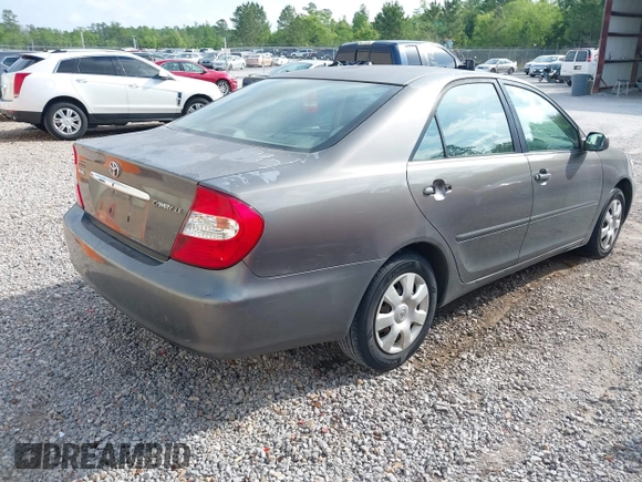 2003 Toyota Camry LE with VIN 4T1BE32K03U727447, listed as a IAAI auction lot 42118785 with 325,881 mi miles and . Bid and sale history available at DreamBid. Image 4.