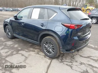 2021 Mazda CX-5 Touring with VIN JM3KFBCM7M1380396, listed as a IAAI auction lot 41707612 with 55,555 mi miles. Bid and sale history available at carsss.com. Image 3.