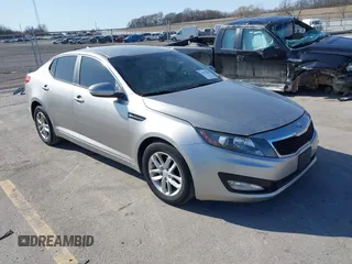 2013 Kia Optima LX with VIN KNAGM4A73D5356339, listed as a IAAI auction lot 41979364 with 140,000 mi miles. Bid and sale history available at carsss.com. Image 1.