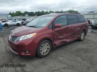 2014 Toyota Sienna XLE with VIN 5TDYK3DC4ES526946, listed as a Copart auction lot 58753145 with 60,169 mi miles and Salvage title. Bid and sale history available at DreamBid. Image 1.