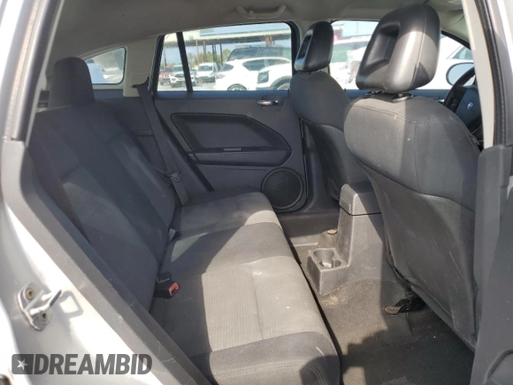 2009 Dodge Caliber SXT with VIN 1B3HB48AX9D157186, listed as a Copart auction lot 52892065 with 218,024 mi miles and Salvage Title. Bid and sale history available at carsss.com. Image 11.