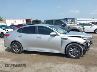 2019 Kia Optima LX z VIN 5XXGT4L37KG281329, wystawiony jako IAAI lot #42434855 z przebiegiem 113 448 mil mil oraz . Historia ofert i sprzedaży dostępna na DreamBid. Obrazek 13.