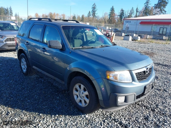 2010 Mazda Tribute Touring with VIN 4F2CY9C73AKM04595, listed as a IAAI auction lot 40797681 with 122,774 mi miles. Bid and sale history available at carsss.com. Image 1.