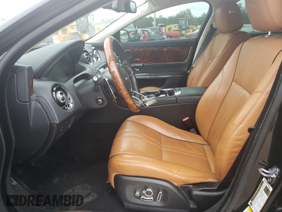 2017 Jaguar XJ with VIN SAJWA1C73H8W10544, listed as a Copart auction lot 70025724 with 64,437 mi miles and Salvage Title. Bid and sale history available at carsss.com. Image 7.