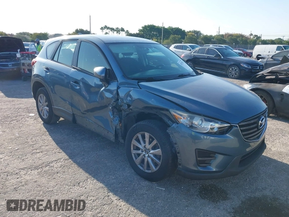 2016 Mazda CX-5 Sport with VIN JM3KE2BY8G0864983, listed as a IAAI auction lot 42072385 with 141,104 mi miles. Bid and sale history available at carsss.com. Image 1.