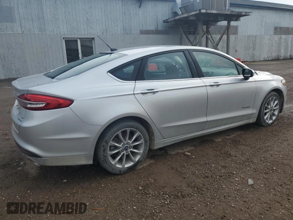 2017 Ford Fusion Hybrid SE z VIN 3FA6P0LU4HR384645, wystawiony jako Copart lot #56454995 z przebiegiem 165 322 mil mil oraz Czysty tytuł • Clean title. Historia ofert i sprzedaży dostępna na DreamBid. Obrazek 3.