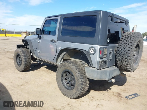 2014 Jeep Wrangler Sport with VIN 1C4AJWAG5EL206565, listed as a IAAI auction lot 42015000 with 90,129 mi miles and . Bid and sale history available at carsss.com. Image 3.
