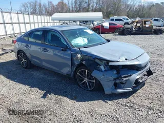2023 Honda Civic Touring z VIN 2HGFE1F94PH308397, wystawiony jako IAAI lot #41670652 z przebiegiem 31 451 mil mil oraz . Historia ofert i sprzedaży dostępna na DreamBid. Obrazek 1.