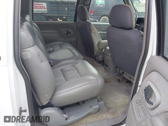 1999 Chevrolet Suburban with VIN 3GNEC16R2XG247140, listed as a IAAI auction lot 41761237 with 202,121 mi miles. Bid and sale history available at carsss.com. Image 8.