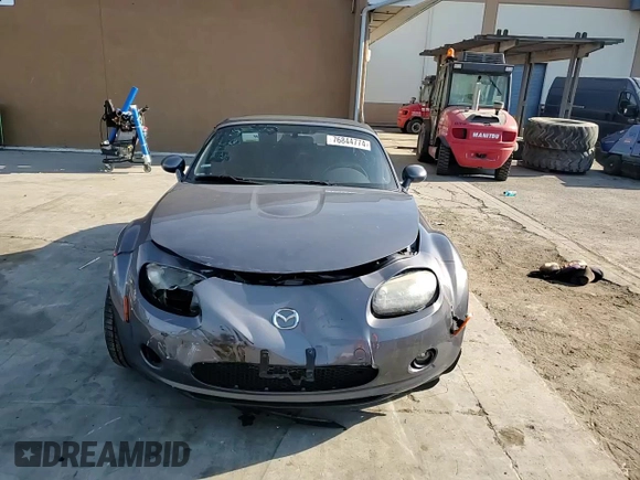 2006 Mazda MX-5 Miata Sport z VIN JM1NC25F260115830, wystawiony jako Copart lot #76844774 z przebiegiem 52 599 mil mil oraz Szkoda całkowita • Salvage title. Historia ofert i sprzedaży dostępna na DreamBid. Obrazek 10.
