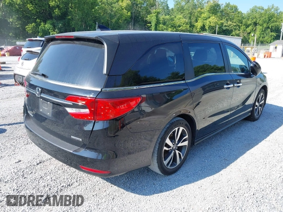 2021 Honda Odyssey Touring with VIN 5FNRL6H84MB027396, listed as a IAAI auction lot 42616650 with 67,207 mi miles and . Bid and sale history available at DreamBid. Image 4.