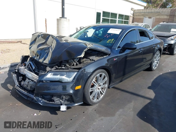 2014 Audi A7 Prestige with VIN WAU2GAFC5EN012583, listed as a IAAI auction lot 42561824 with Not provided miles and . Bid and sale history available at DreamBid. Image 2.