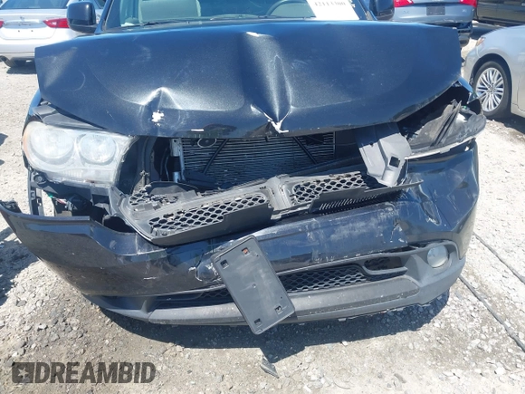 2013 Dodge Durango SXT with VIN 1C4RDJAG8DC617759, listed as a IAAI auction lot 42113300 with 185,152 mi miles and . Bid and sale history available at DreamBid. Image 18.