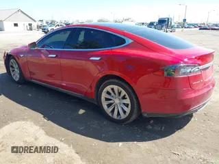 2014 Tesla Model S 60 with VIN 5YJSA1H11EFP37791, listed as a IAAI auction lot 41995504 with 84,371 mi miles and . Bid and sale history available at DreamBid. Image 3.