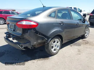 2015 Ford Fiesta SE with VIN 3FADP4BJ1FM217045, listed as a IAAI auction lot 42120444 with 119,207 mi miles and . Bid and sale history available at DreamBid. Image 4.