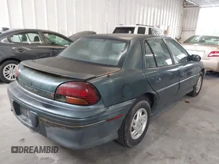 1998 Pontiac Grand Am SE with VIN 1G2NE52T1WC768383, listed as a IAAI auction lot 42220195 with 275,908 mi miles and . Bid and sale history available at DreamBid. Image 4.