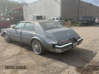1982 Cadillac Seville z VIN 1G6AS6989CE694210, wystawiony jako Copart lot #74978254 z przebiegiem 21 412 mil mil oraz Tytuł czysty. Historia ofert i sprzedaży dostępna na DreamBid. Obrazek 3.