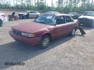 1991 Toyota Camry DLX z VIN 4T1SV21E0MU347371, wystawiony jako IAAI lot #42048695 z przebiegiem 209 451 mil mil oraz . Historia ofert i sprzedaży dostępna na DreamBid. Obrazek 2.