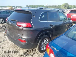 2014 Jeep Cherokee Latitude with VIN 1C4PJLCB6EW241897, listed as a IAAI auction lot 42128880 with 126,242 mi miles. Bid and sale history available at carsss.com. Image 4.
