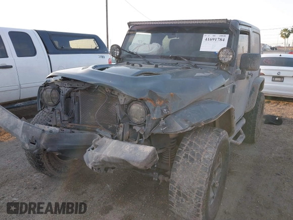 2014 Jeep Wrangler Sport with VIN 1C4AJWAG0EL326774, listed as a IAAI auction lot 41691784 with 98,696 mi miles and . Bid and sale history available at DreamBid. Image 18.
