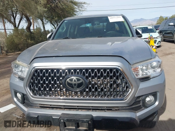 2020 Toyota Tacoma SR5 with VIN 3TMCZ5AN1LM324828, listed as a IAAI auction lot 40977362 with 33,906 mi miles and . Bid and sale history available at DreamBid. Image 12.