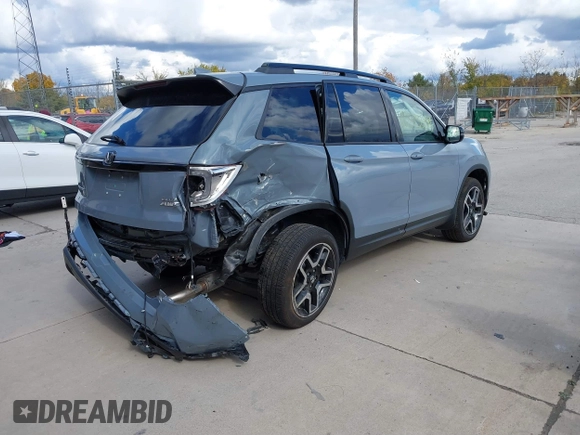2023 Honda Passport Elite with VIN 5FNYF8H03PB000039, listed as a IAAI auction lot 40593339 with 33,697 mi miles and . Bid and sale history available at DreamBid. Image 4.
